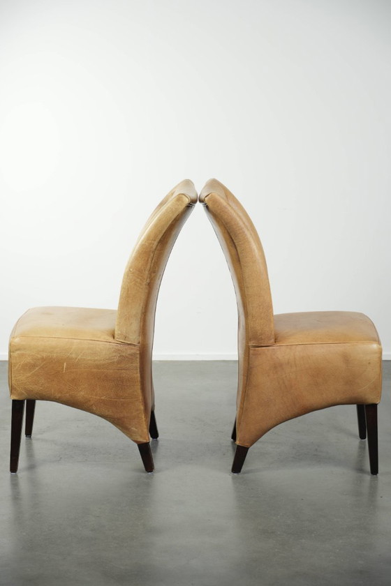 Image 1 of 6 chaises de salle à manger en cuir de vachette clair, avec une belle couleur claire, une assise confortable et un dossier haut.