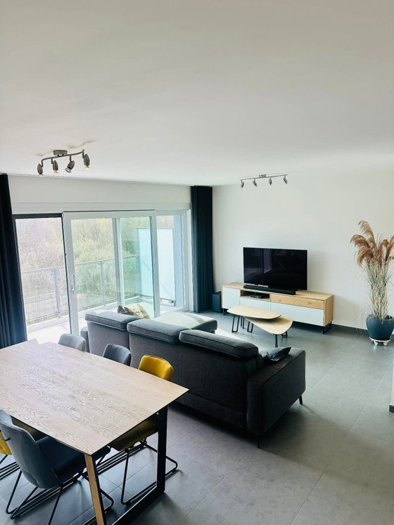 Image 1 of Ensemble XOOON Darwin : buffet, meuble TV, table et chaises, table basse, table à manger et fauteuil.