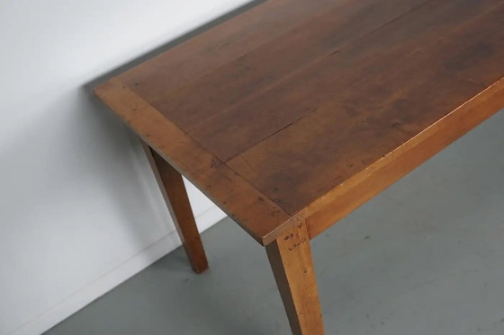 Image 1 of Antiker französischer rustikaler Bauernhaus-Esstisch aus Kirschholz aus dem frühen 20. Jahrhundert