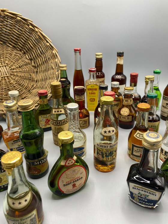 32 vintage miniature spirit bottles and large wicker basket – Decorative Objects, Glass, Mid Century Modern (photo 4 of 8)