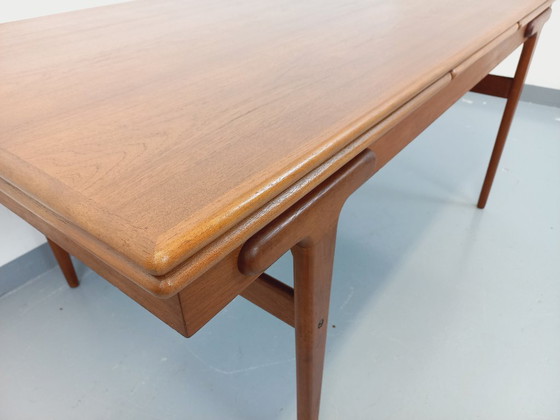 Image 1 of Vintage Scandinavian rectangular dining table by Ejvind A. Johansson from the 50s and 60s in teak with integrated extensions