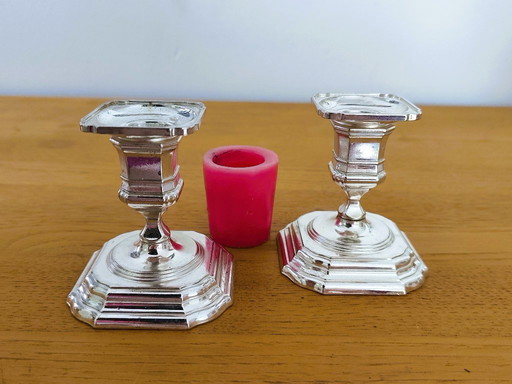 Pair of antique silver-plated metal candlesticks