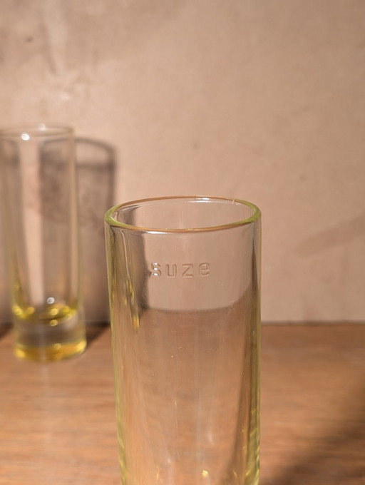 Set di 4 bicchieri a tubo SUZE, gialli, di Jean Nouvel