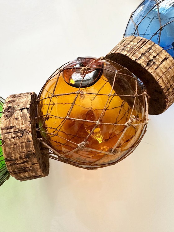 Image 1 of Fishing float made of blown glass, cork, and rope. France, 1960s