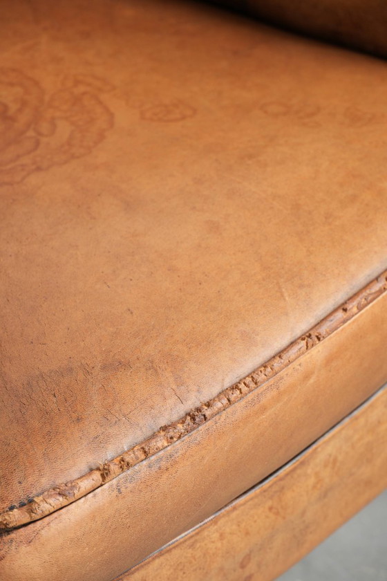 Image 1 of 2 x Subtiele karaktervolle vintage schapenleren clubfauteuil met een mooie lichte kleur en een mooie patina look