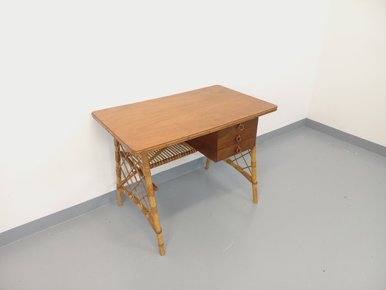 Image 1 of Vintage Louis Sognot bureau in rotan en hout uit de jaren 60