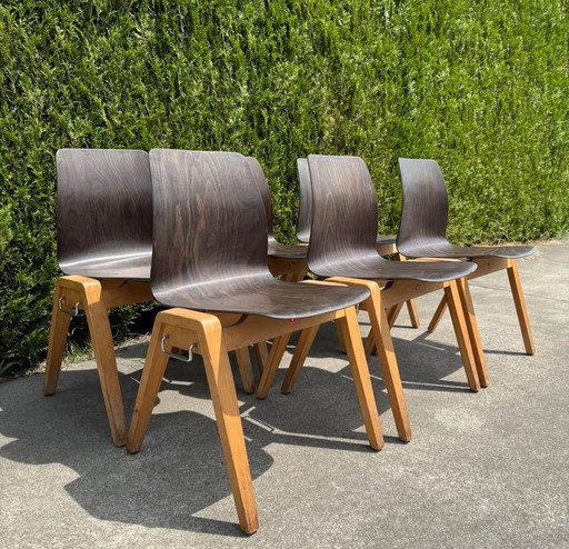 6 stacking chairs by Adam Stegner