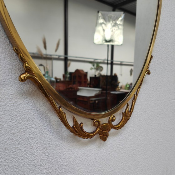 Image 1 of Vintage Goudkleurige Ovale spiegel kuifspiegel schouwspiegel. Koper 