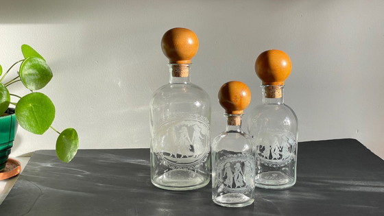 Image 1 of Vintage Engraved Glass and Wood Bottles