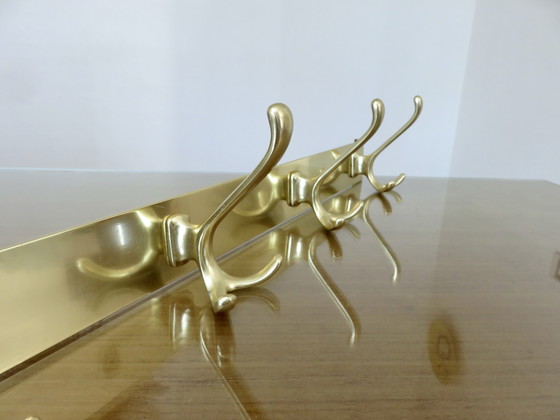 Image 1 of Large wall-mounted coat rack in gilded aluminum, France, 1970