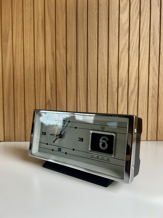 Image 1 of Vintage desk clock with flip date, made in Shanghai China.