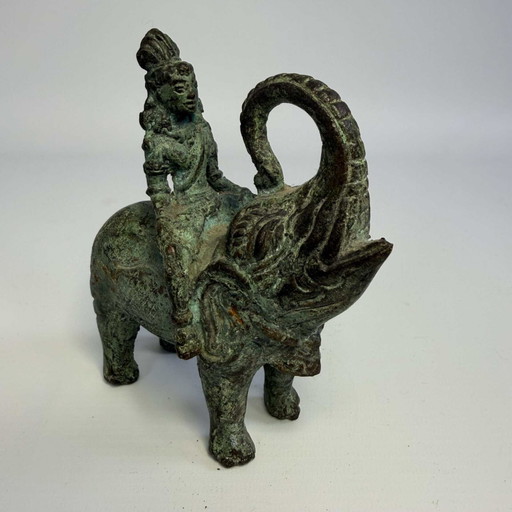 Antique bronze sculpture of man on elephant
