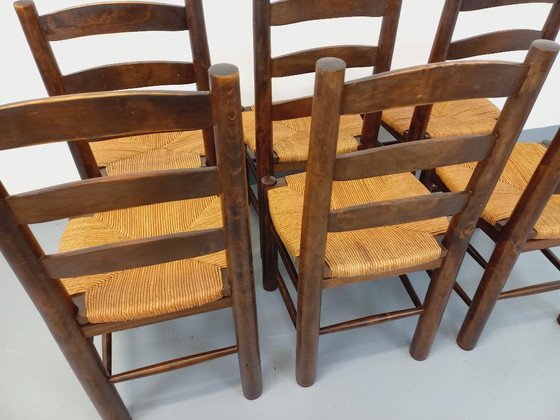 Image 1 of Set van 6 vintage brutalistische stoelen van Georges Robert, gemaakt van hout en stro, uit de jaren 50 en 60.