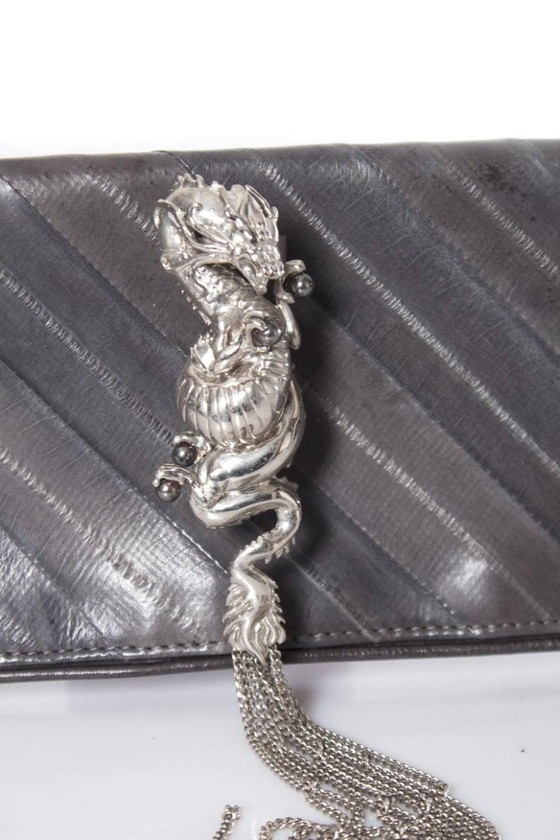 Image 1 of Maison Du Posh, pochette con anello a nocca e drago.