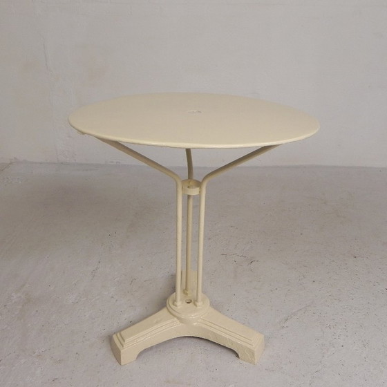 Bistro table with cast iron legs and round steel top, 1930s – Dining tables (photo 12 of 22)