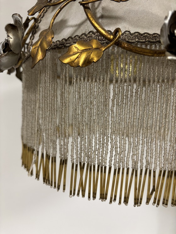 Image 1 of Exclusive chandelier with brass leaves and silver-colored roses