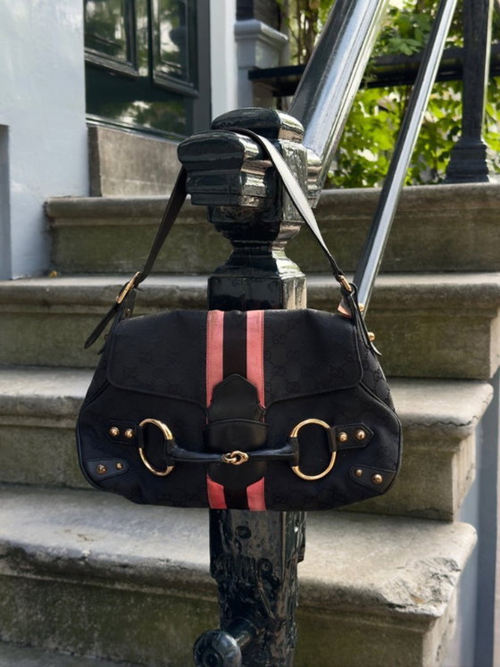 Image 1 of borsa con morsetto per cavalli
