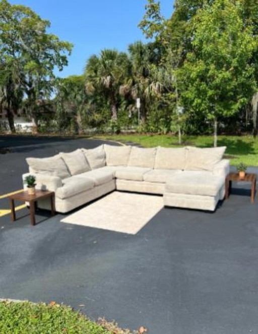 Beige Rooms To Go Sectional Couch & Storage Ottoman