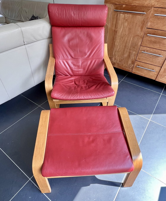 Image 1 of Red leather armchair with footstool