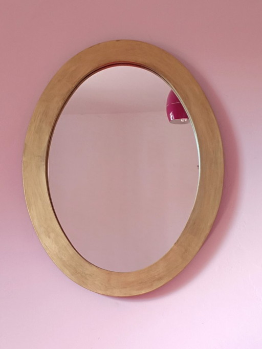 Oval mirror with gold frame