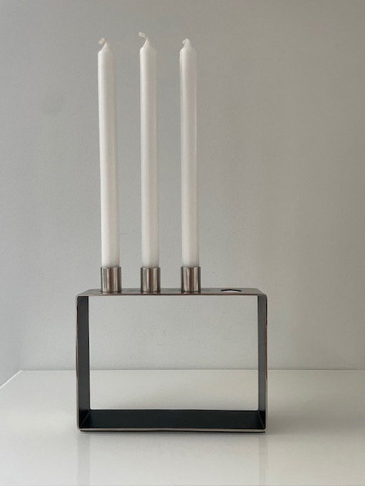 Moderno candeliere in acciaio inox per 3 candele da cena