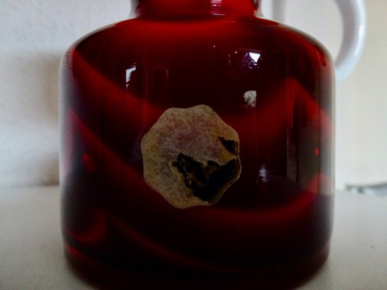 Image 1 of Vintage Murano vase in a wavy pattern with a white handle.