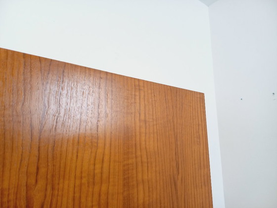 Image 1 of Vintage kledingkast in modernistische stijl van teakhout en metaal uit de jaren 60.