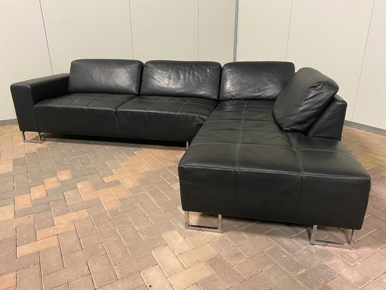 Image 1 of Piet Klerkx zwarte hoekbank van echt leer met comfortabele zitplaatsen en ruime hoek.