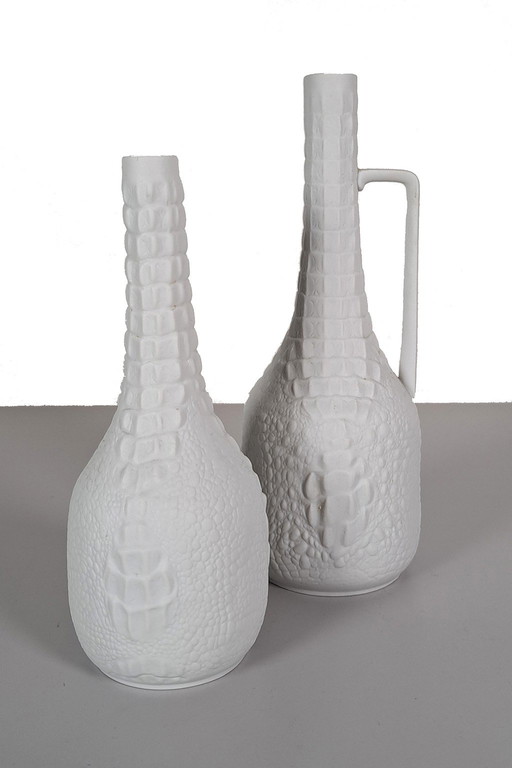 Pair of biscuit porcelain vases