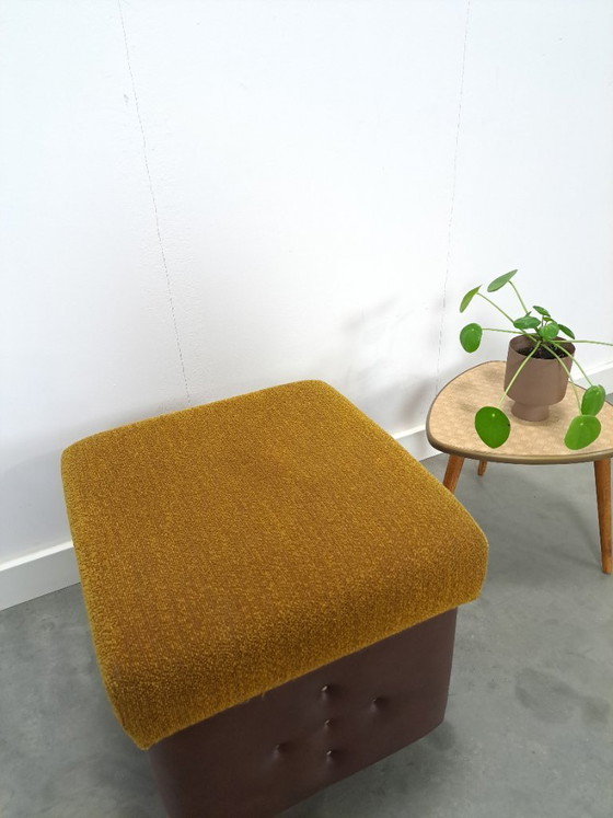 Image 1 of Ottoman with lid on chrome wheels