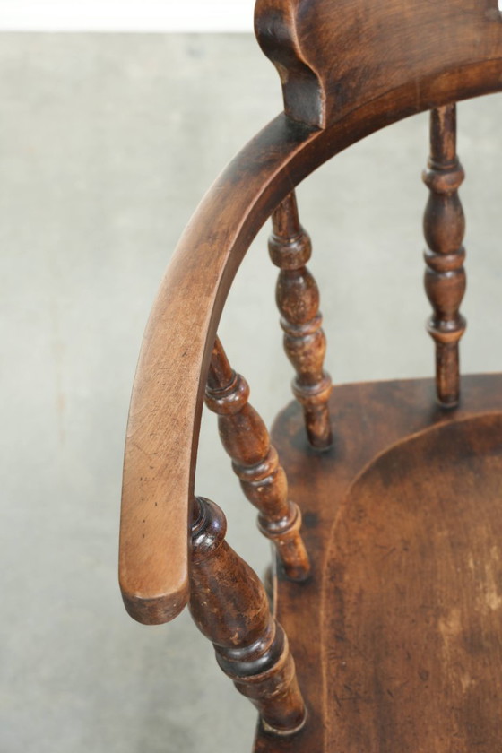Image 1 of 2x antique English wooden pub/captain chairs from the late 19th century with character and a beautiful color scheme