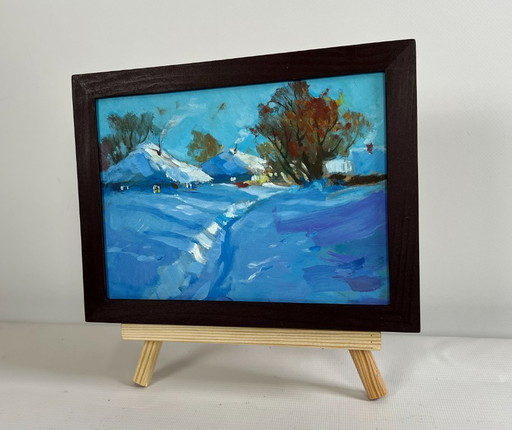 Origineel olieverfschilderij: Winterdorplandschap met een pad door de sneeuw.
