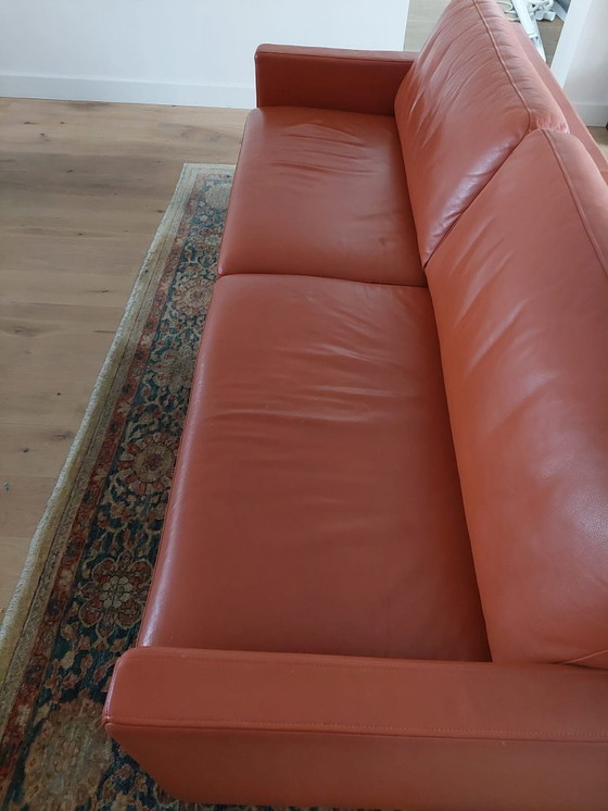 Image 1 of Rolf Benz 4-seater leather sofa, orange/terracotta.