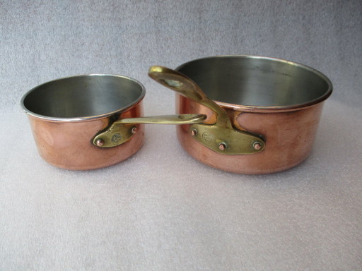 Copper saucepans, set of two, marked made in Portugal, 1980.