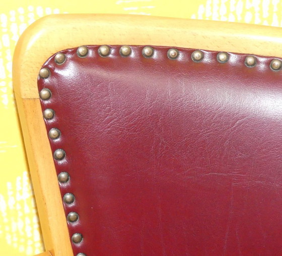 Image 1 of Armchair upholstered spring core skai leather oxblood decorative rivets office chair 60s retro