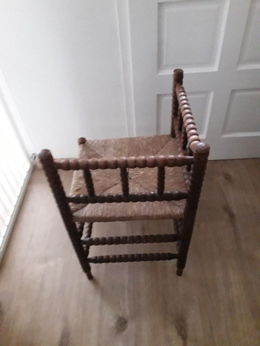 Antiker Eckstuhl aus Korbgeflecht