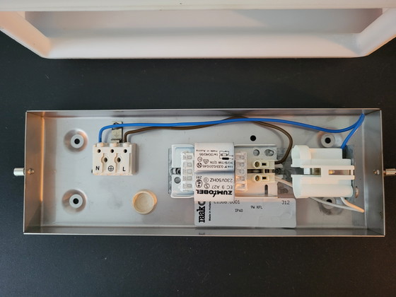 Image 1 of 3 RAAK (bathroom) wall lamps with opaline glass shade and stainless steel frame.