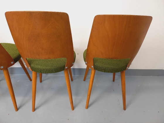 Image 1 of Set van 4 vintage Mondor stoelen van Baumann in hout en bouclé stof uit de jaren 60