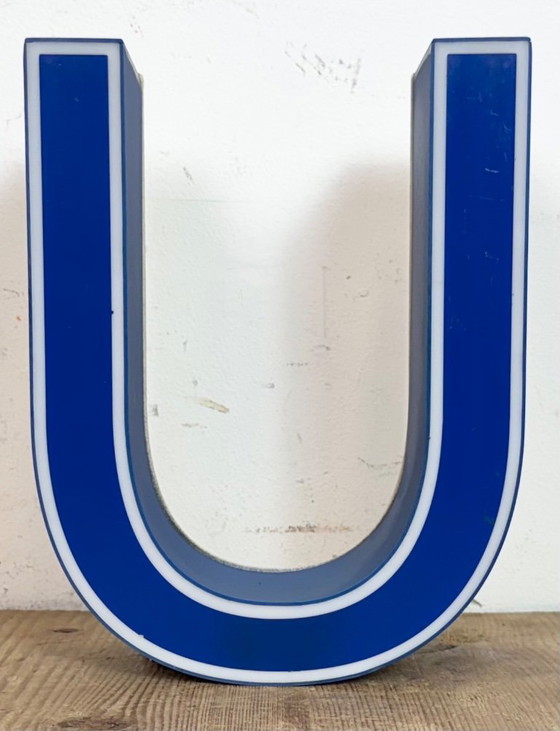 Image 1 of Industrial dark blue enamel factory pendant light made in United Kingdom during the 1950s. White enamel inside the shade. Brass 