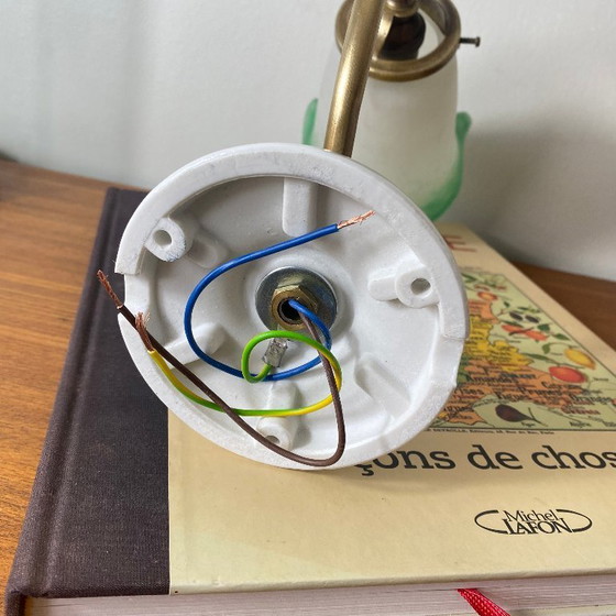 Image 1 of Brass swan-neck wall sconce with a glass paste tulip shade, signed Rethondes