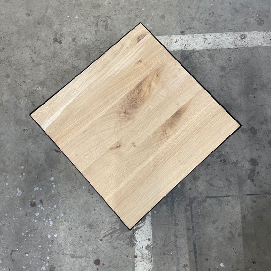 Image 1 of Design industriel : Table basse avec plateau en chêne massif et piètement patiné