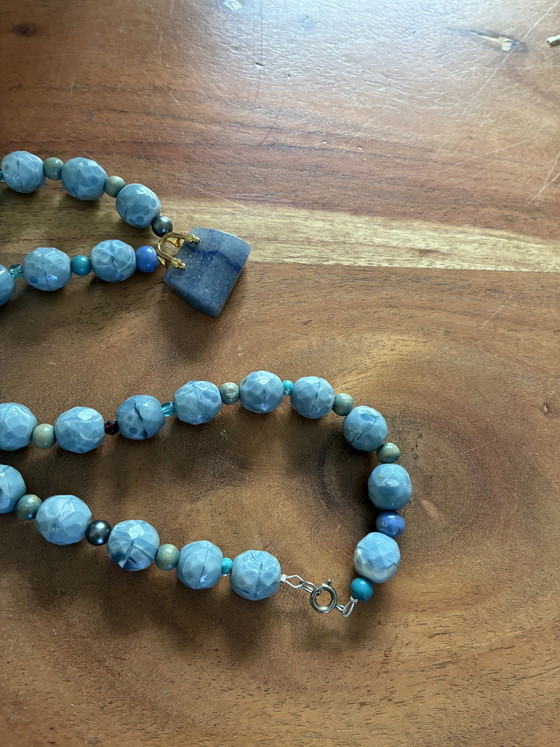 Image 1 of New necklace with blue vintage beads and a small agate bag as a pendant