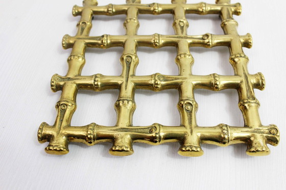 Image 1 of Onderzetter van imitatie bamboe en messing