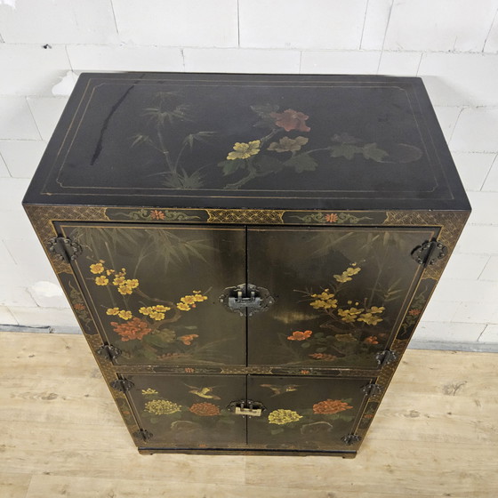 Image 1 of Vintage black Chinese lacquer cabinet with flowers and birds / bohemian / Asian / Oriental cabinet