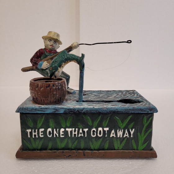 Image 1 of "Fisherman" piggy bank with fishing mechanism, cast iron, 1950s - USA.