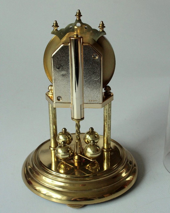 Image 1 of Elegant Hermle brass torsion pendulum clock with glass dome - Vintage