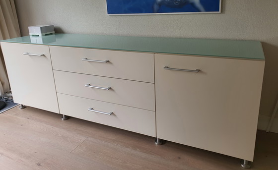 Image 1 of White modern sideboard with a separate glass top. Heavy-duty quality.