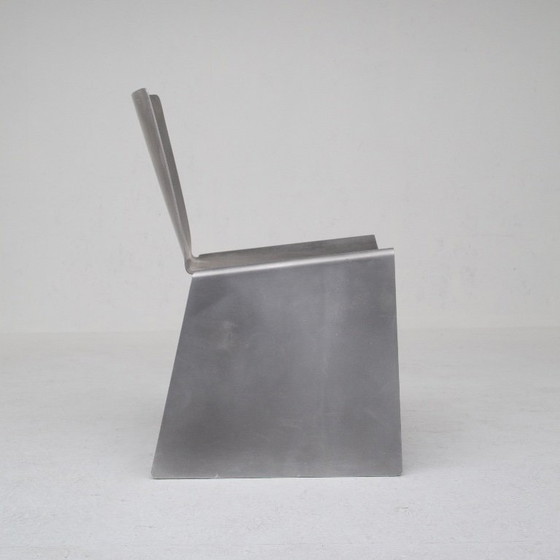 Image 1 of Metalen stoel en bijzettafelset van Xavier Lust