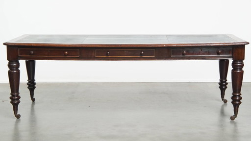 Antique English writing desk/ partner desk with blue leather top from mid 19th century