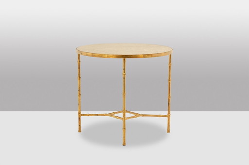 Sokkeltafel. Verguld metalen onderstel en grijs marmeren blad. 20e eeuw.